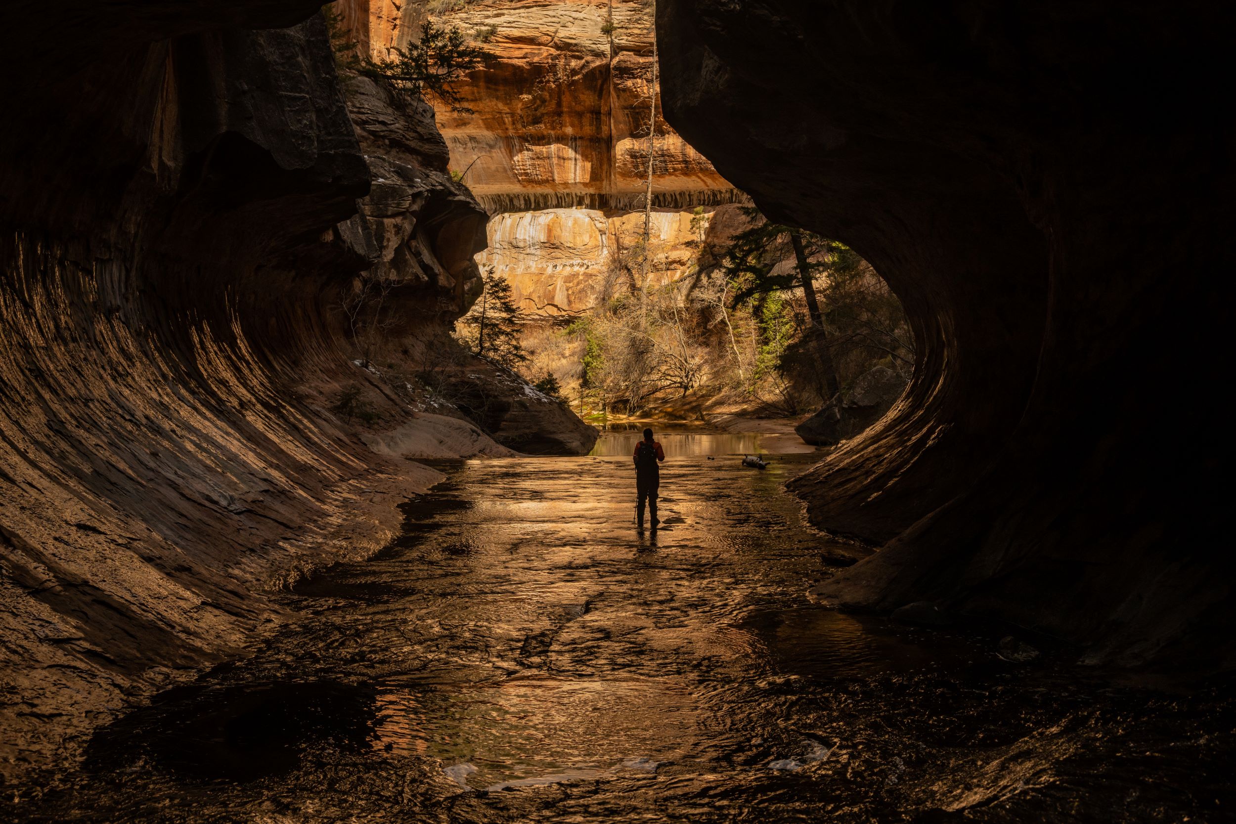 A hiker in Zion's Subway.