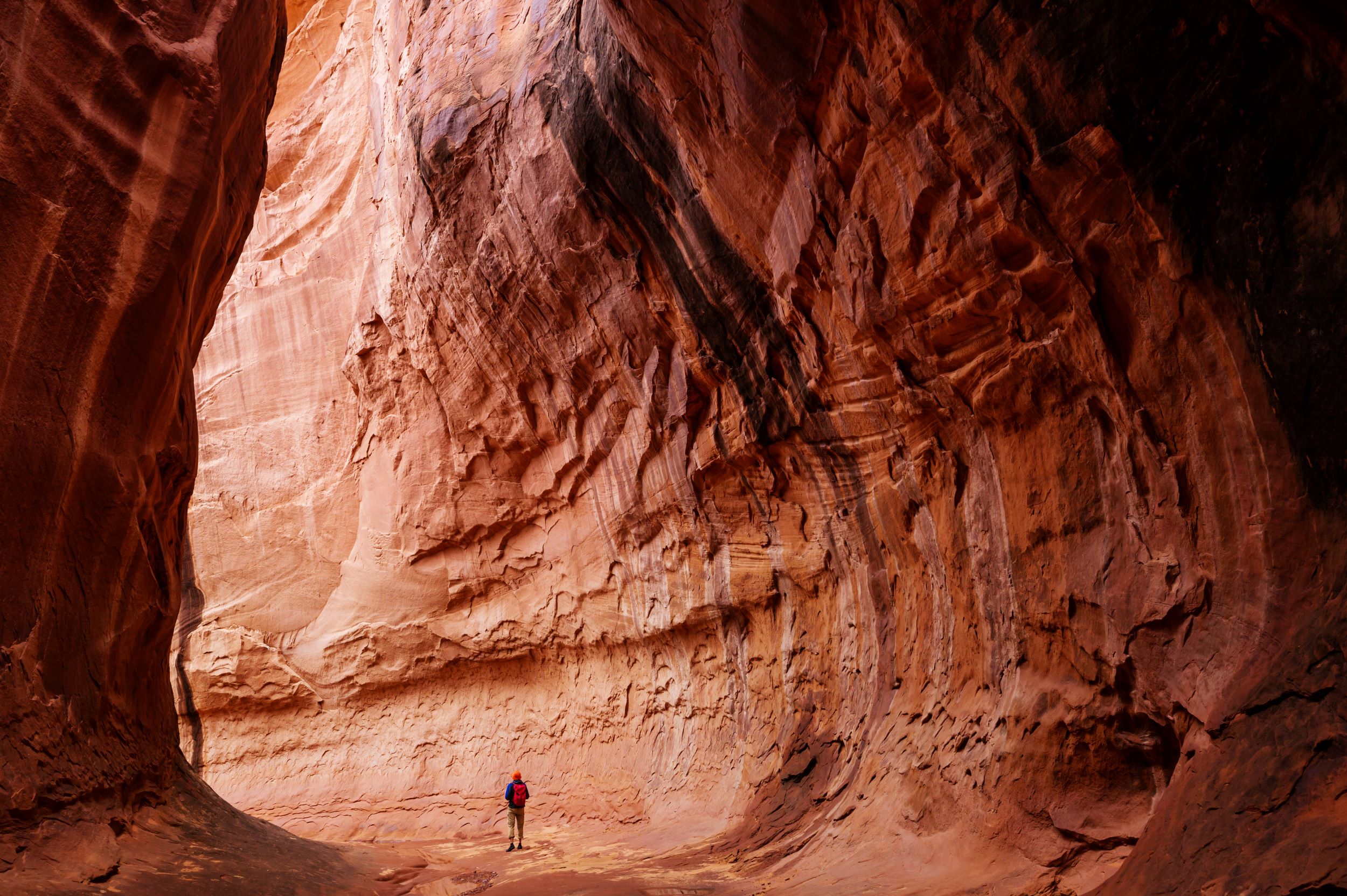 A hiker in a slot canyon.
