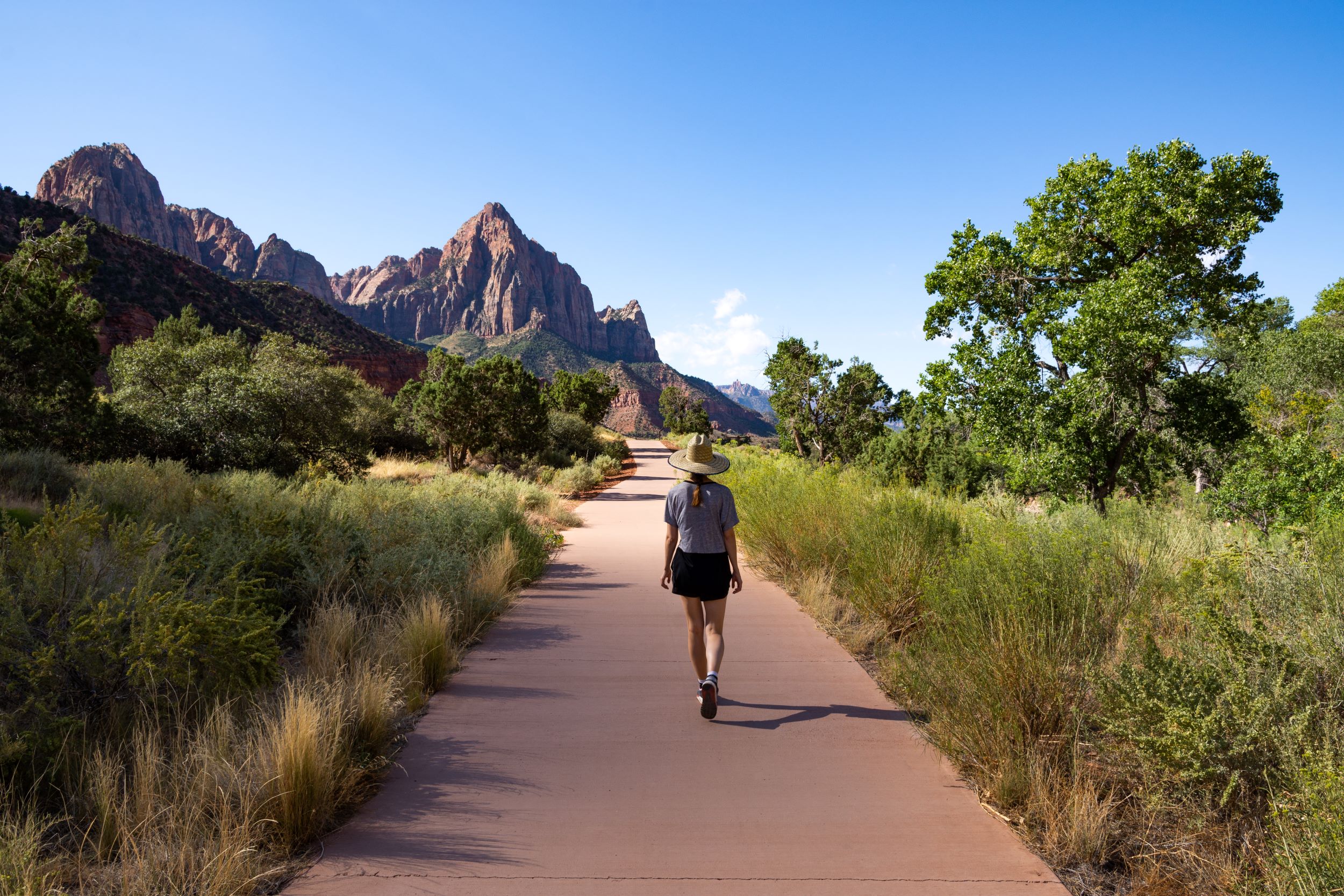 A woman walking in Zion National Park.