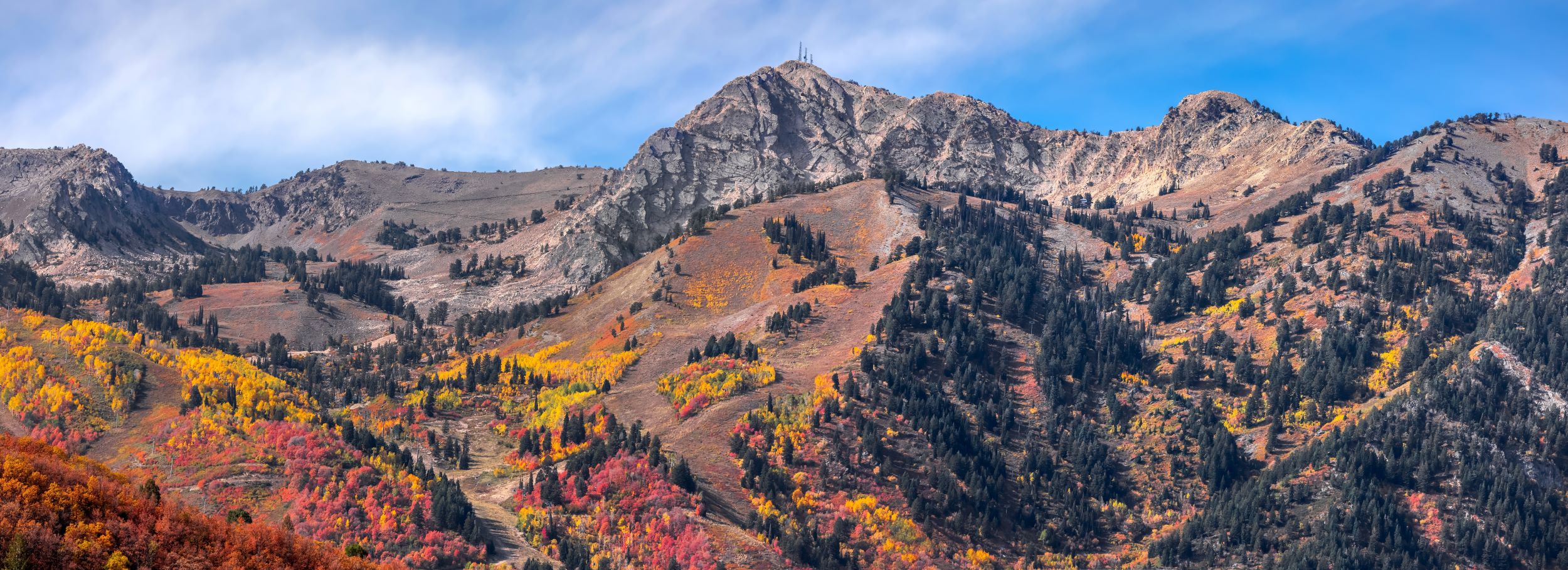 Mt Ogden peak with colorful fall foliage in Utah.