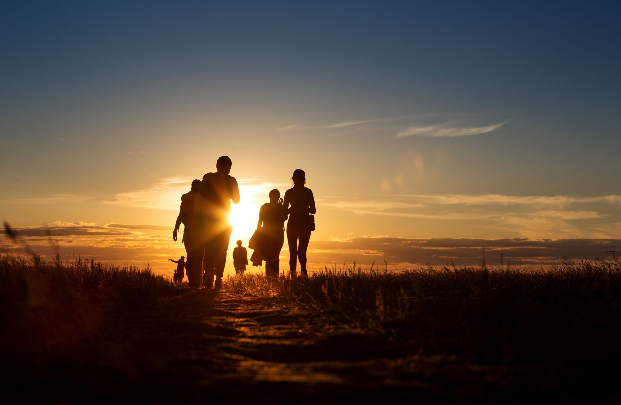 A group of hikers at sunset.