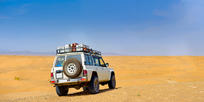 A vehicle in the desert.